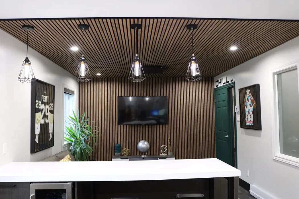 Akupanel slats on the ceiling and wall of an office.