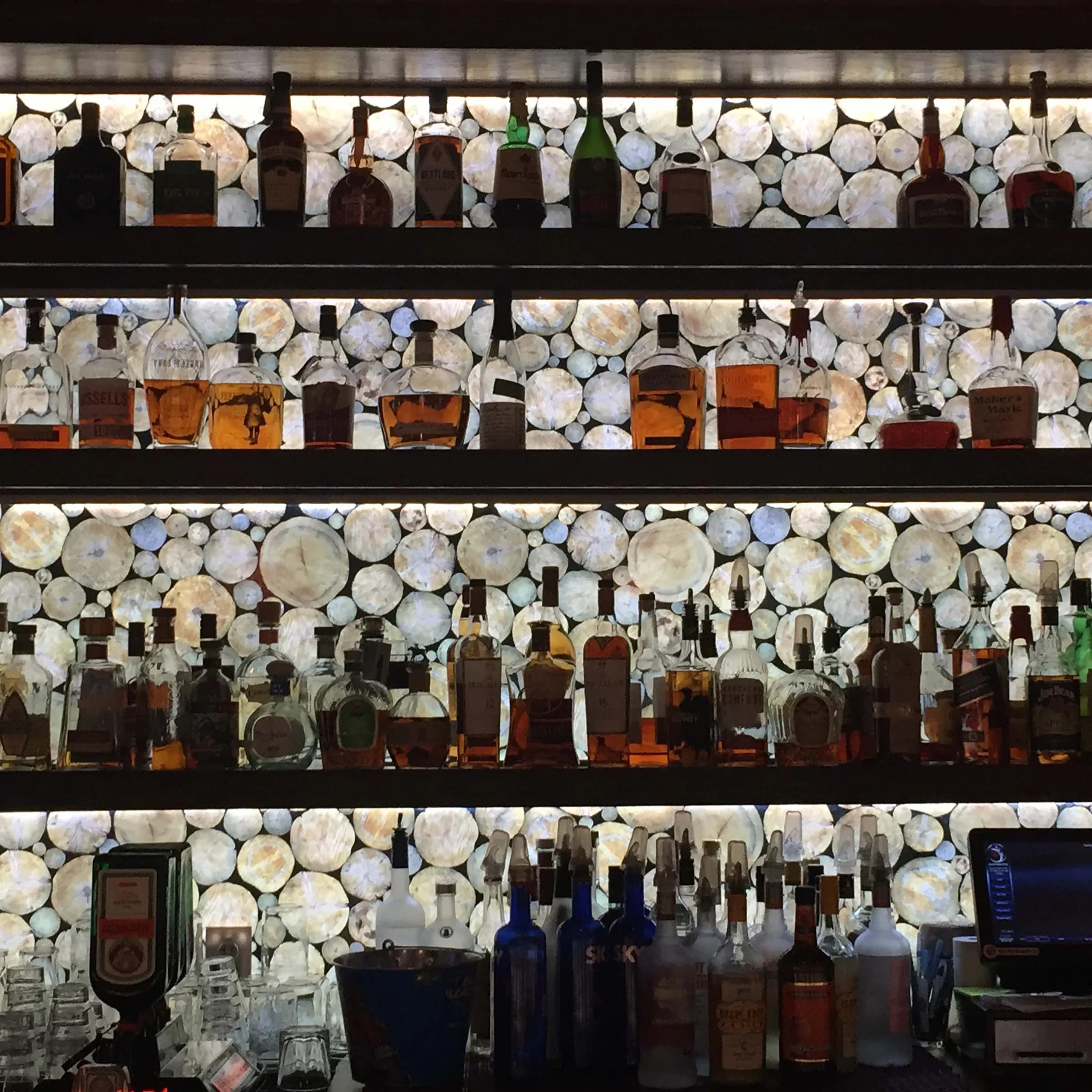 LumiSplash log-end panels behind a back bar.