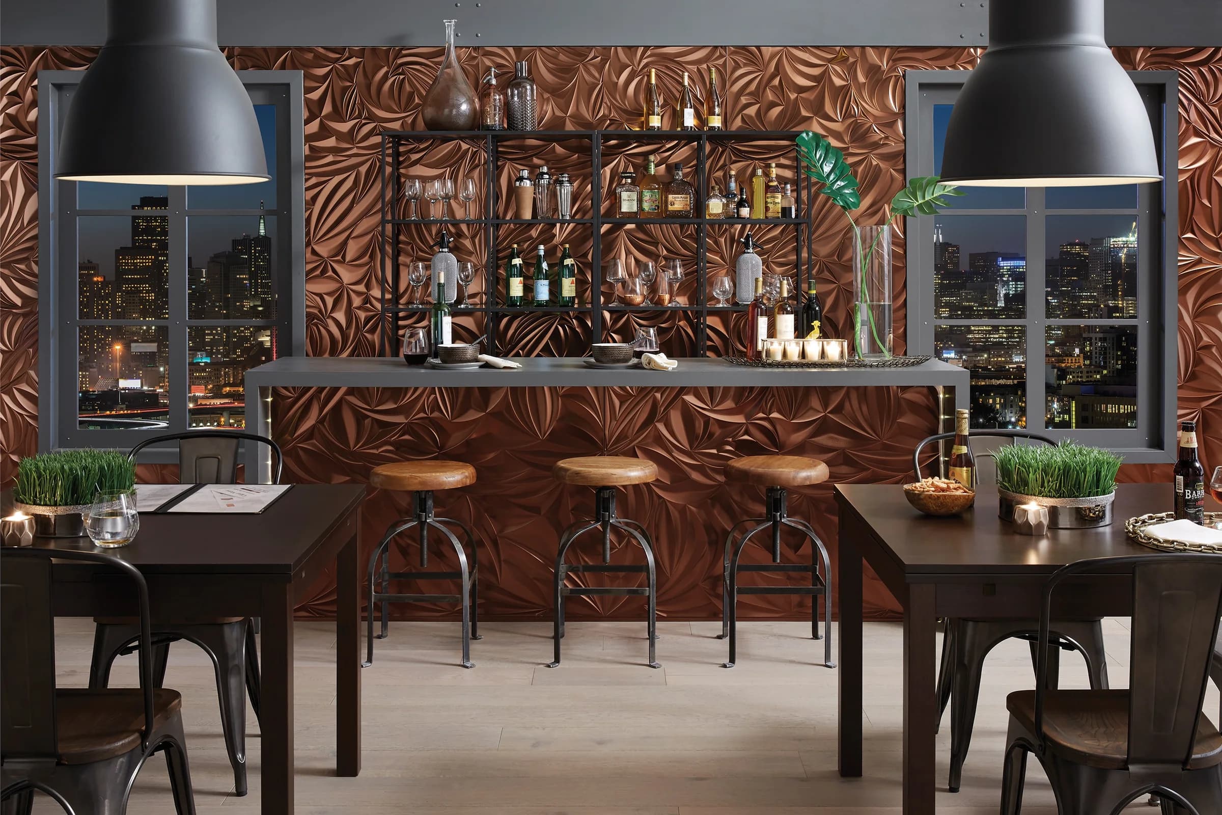 Bar wall clad in MirroFlex Sculpted Petals panels in Oil Rubbed Bronze behind a restaurant counter.