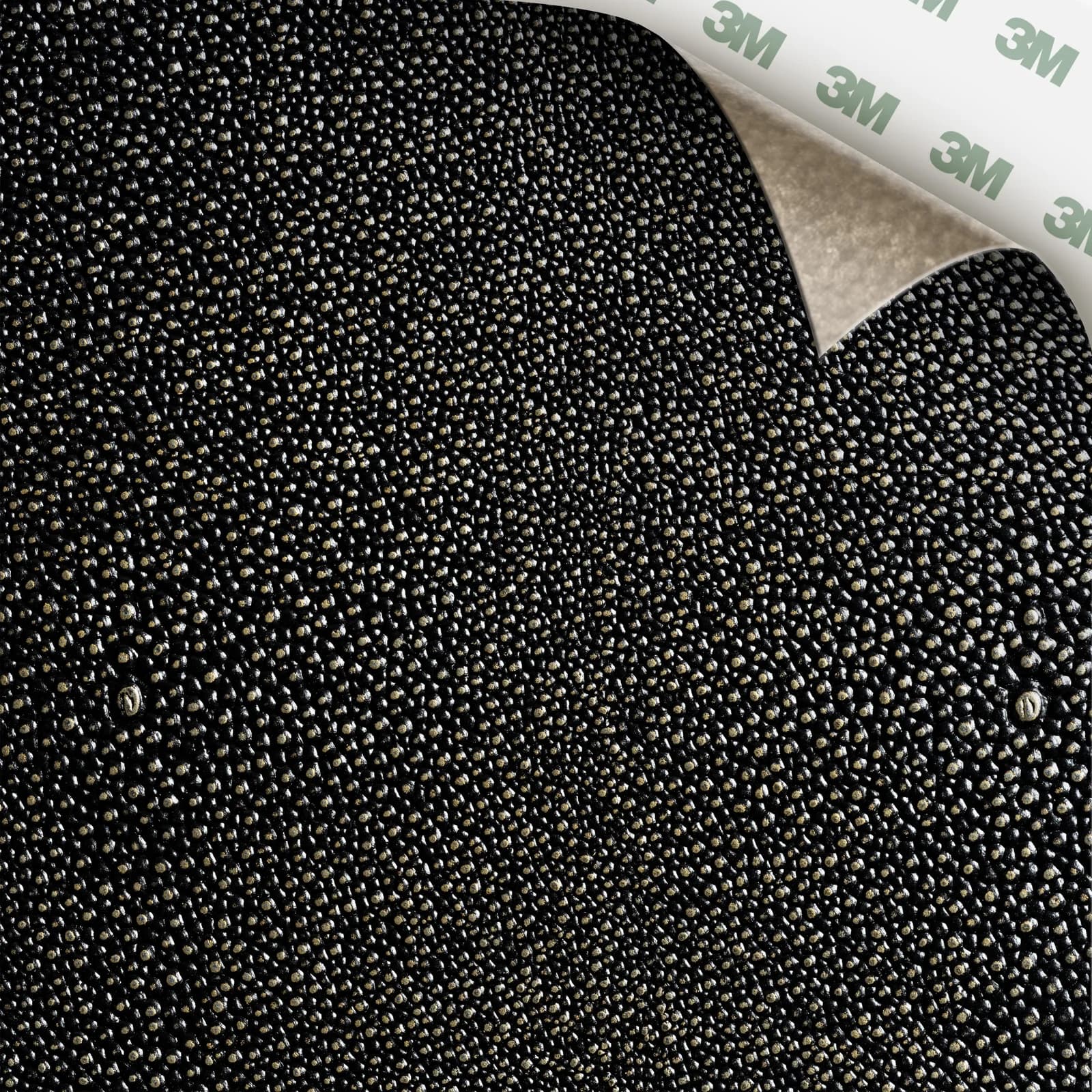 EcoDomo Stratto Black Knight Shagreen swatch with the peel-and-stick backing showing.