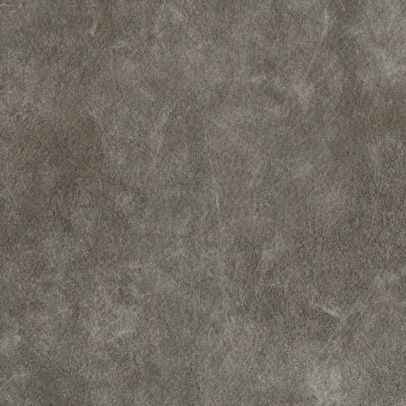 A leather-inspired laminate pattern in gray tones, defined by organic grain, shallow tonal creasing, and tactile visual depth