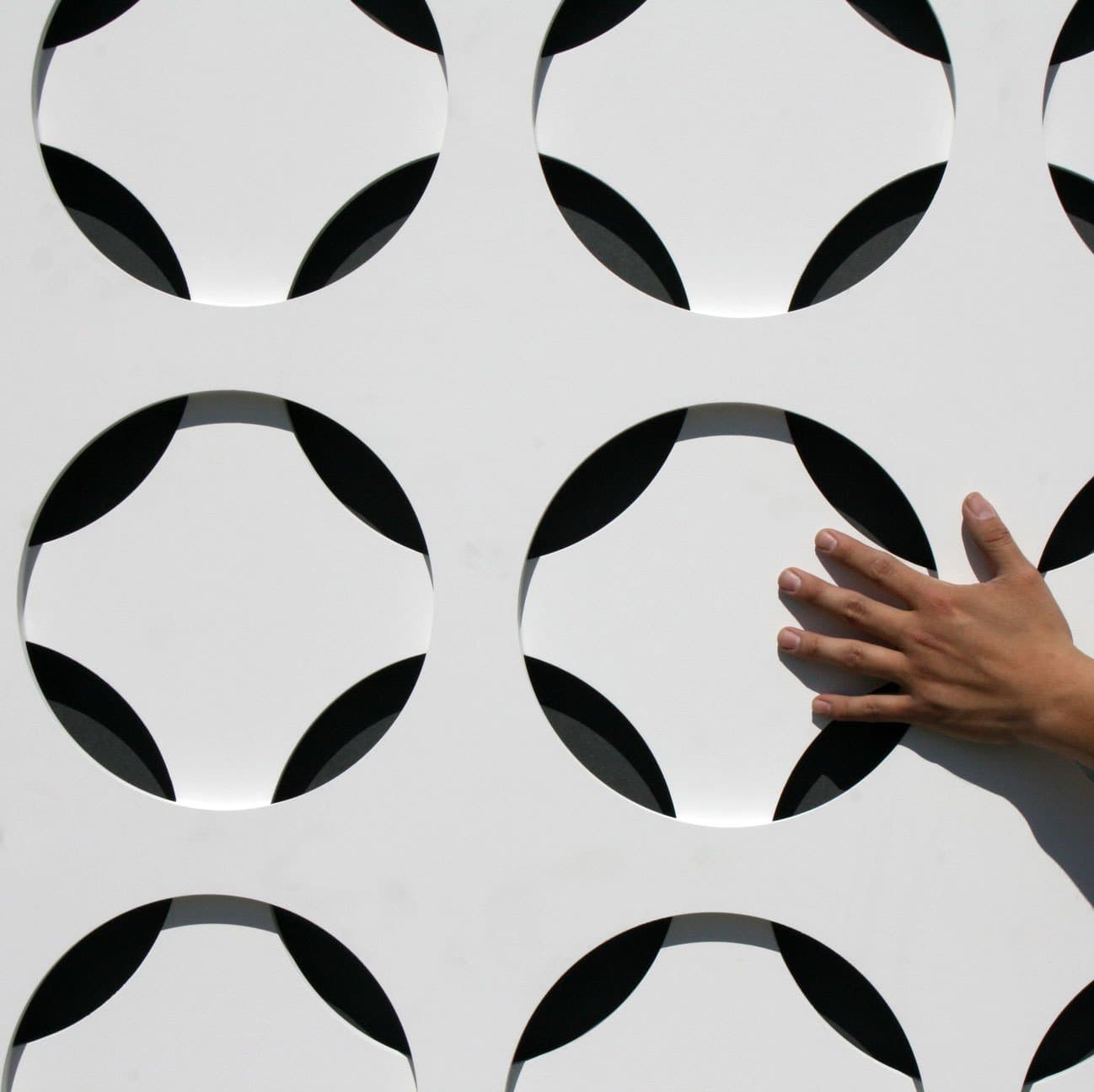 Interlam Carved Screens Circle 2 Customizable Color Options Carved Screens material sample.