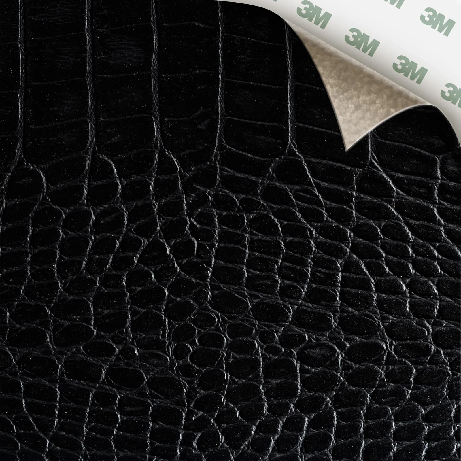EcoDomo Stratto Coal Crocodile swatch with the peel-and-stick backing showing.