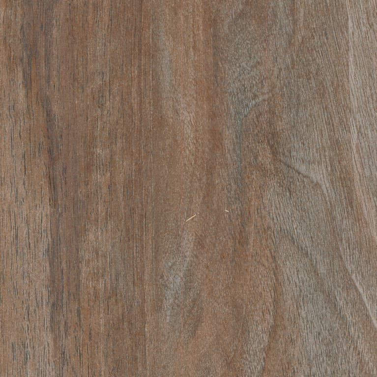 A woodgrain laminate pattern in silver-gray and walnut-brown tones, defined by natural grain movement and layered tonal variation