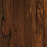 A woodgrain laminate pattern in mocha brown tones, defined by natural grain movement and layered tonal variation