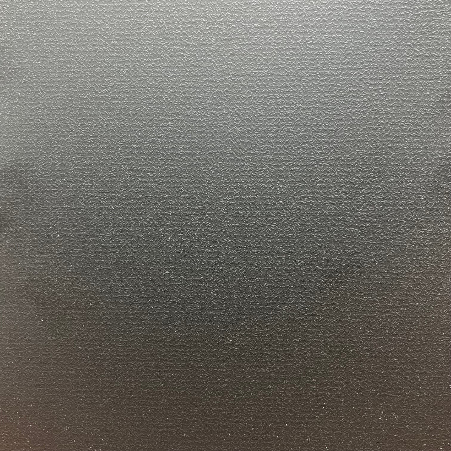 An abstract laminate pattern in black tones, defined by layered marks, tonal variation, and restrained visual movement