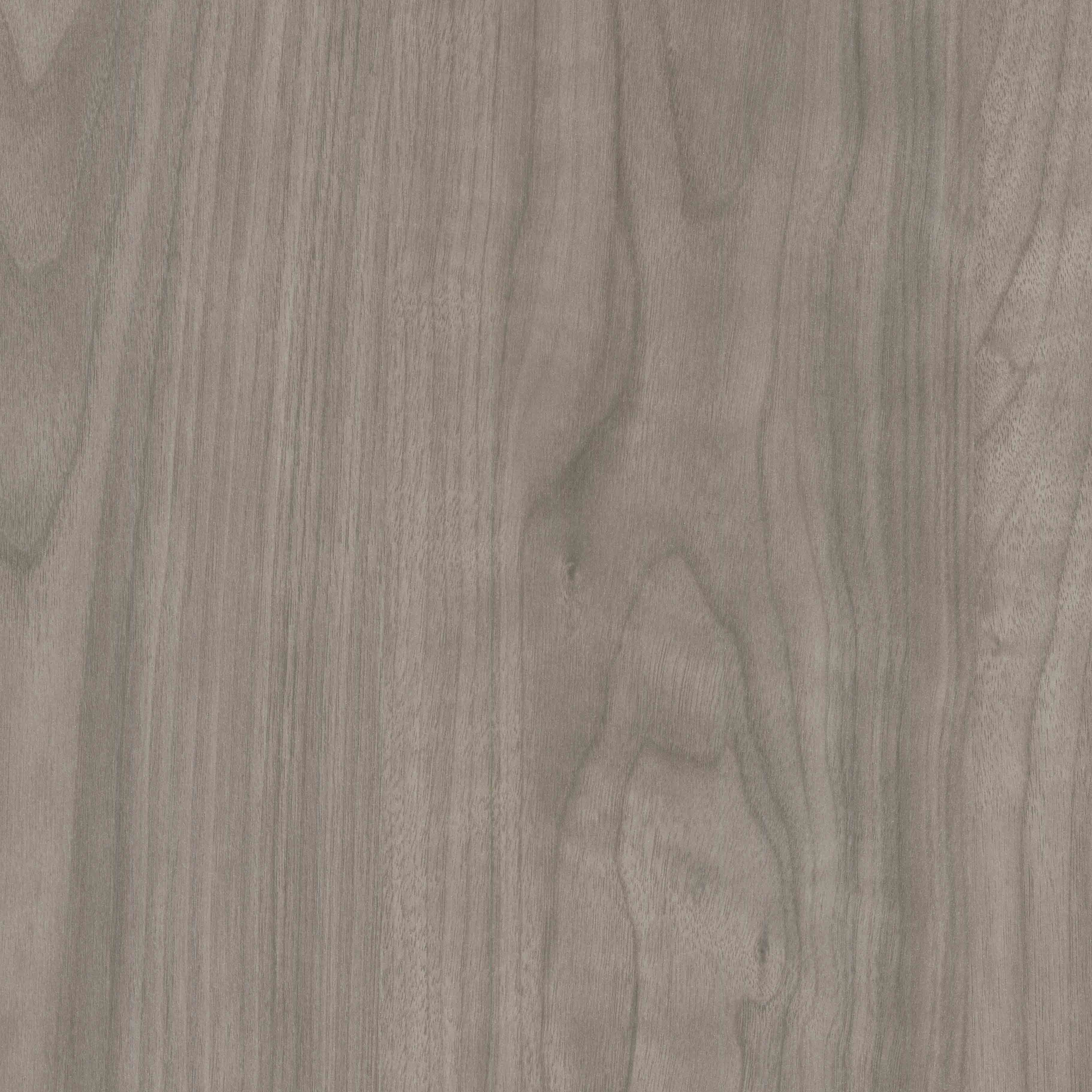 An abstract laminate pattern in gray tones, defined by layered marks, tonal variation, and restrained visual movement