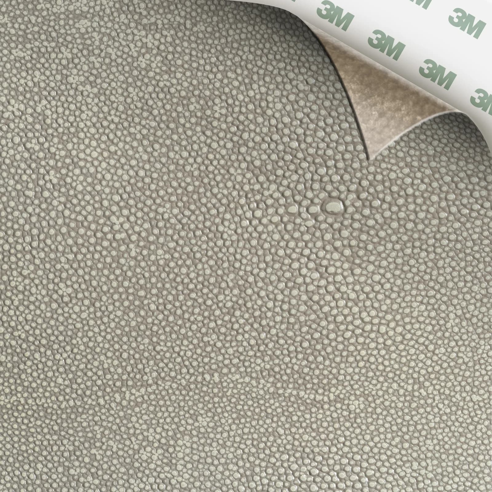 EcoDomo Stratto Coco Shagreen swatch with the peel-and-stick backing showing.