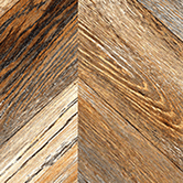 A woodgrain laminate pattern in natural neutral and weathered mid-tone hues, defined by natural grain movement and layered tonal variation