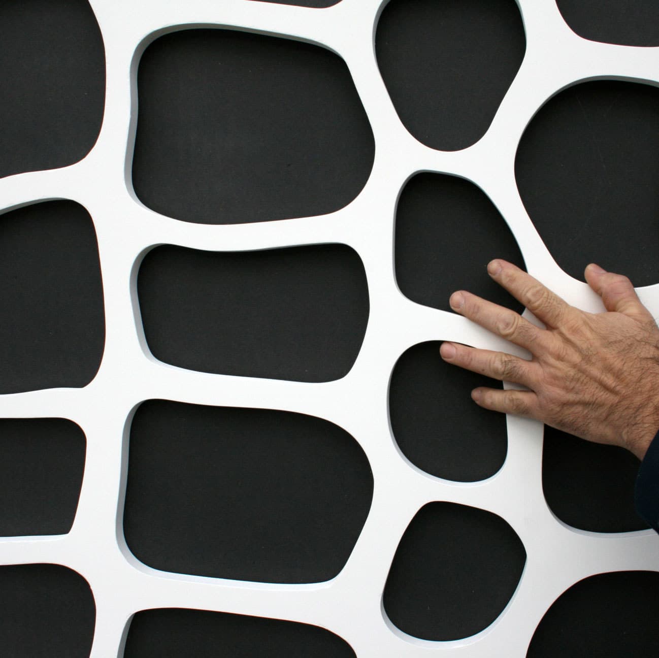 Interlam Carved Screens Cells Customizable Color Options Carved Screens material sample.
