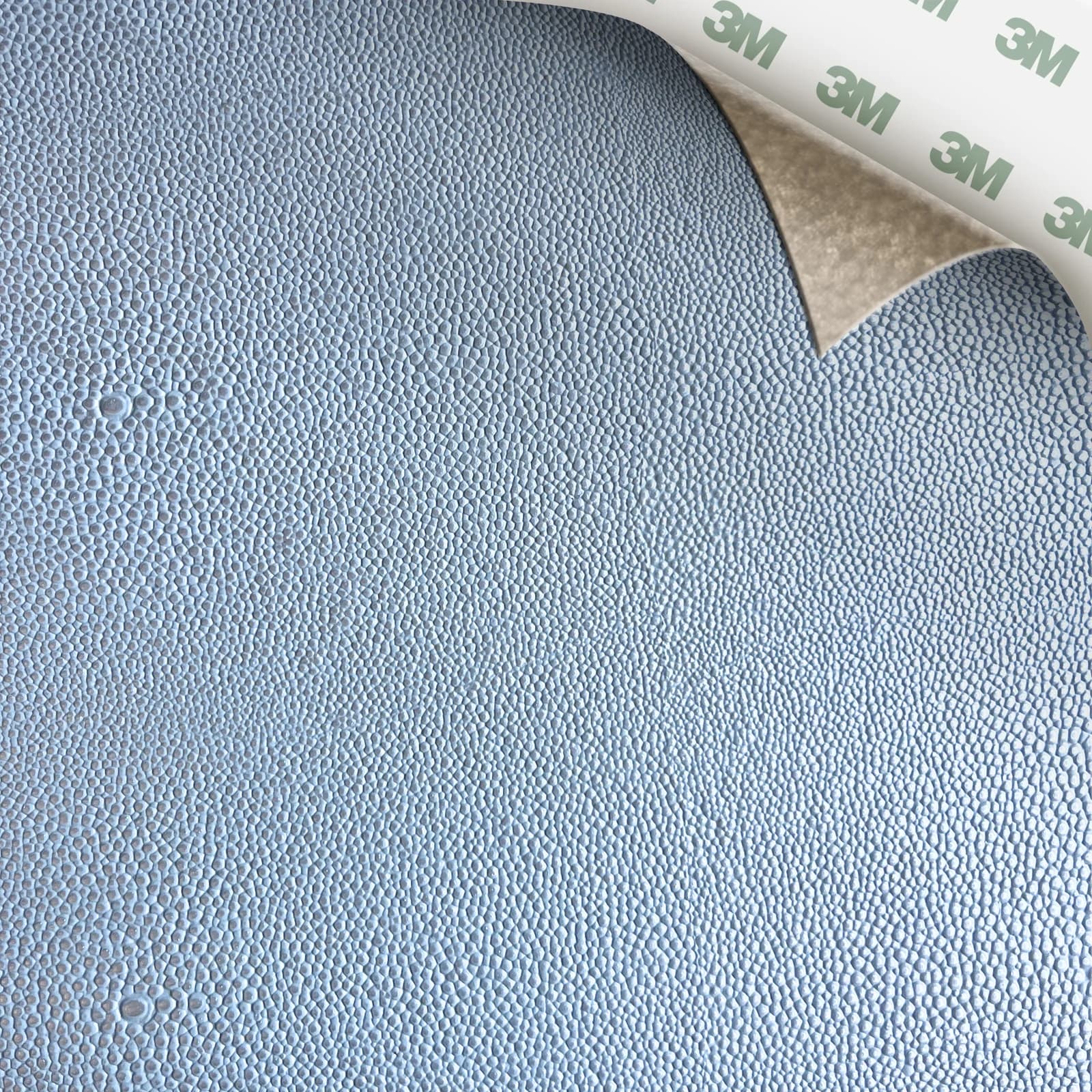 EcoDomo Stratto Arctic Blue Shagreen swatch with the peel-and-stick backing showing.