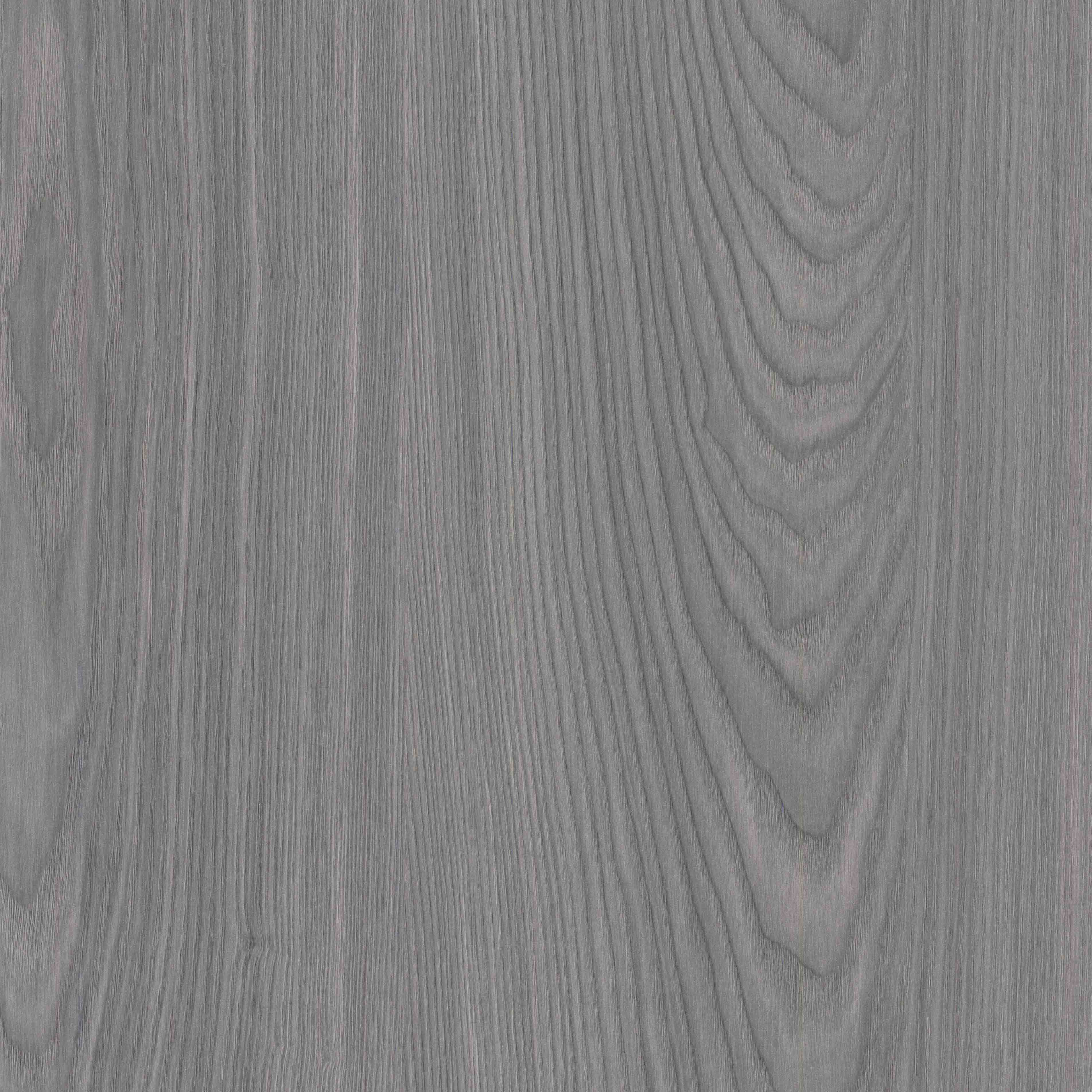 An abstract laminate pattern in gray tones, defined by layered marks, tonal variation, and restrained visual movement