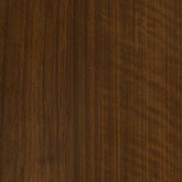 A woodgrain laminate pattern in brown tones, defined by natural grain movement and layered tonal variation