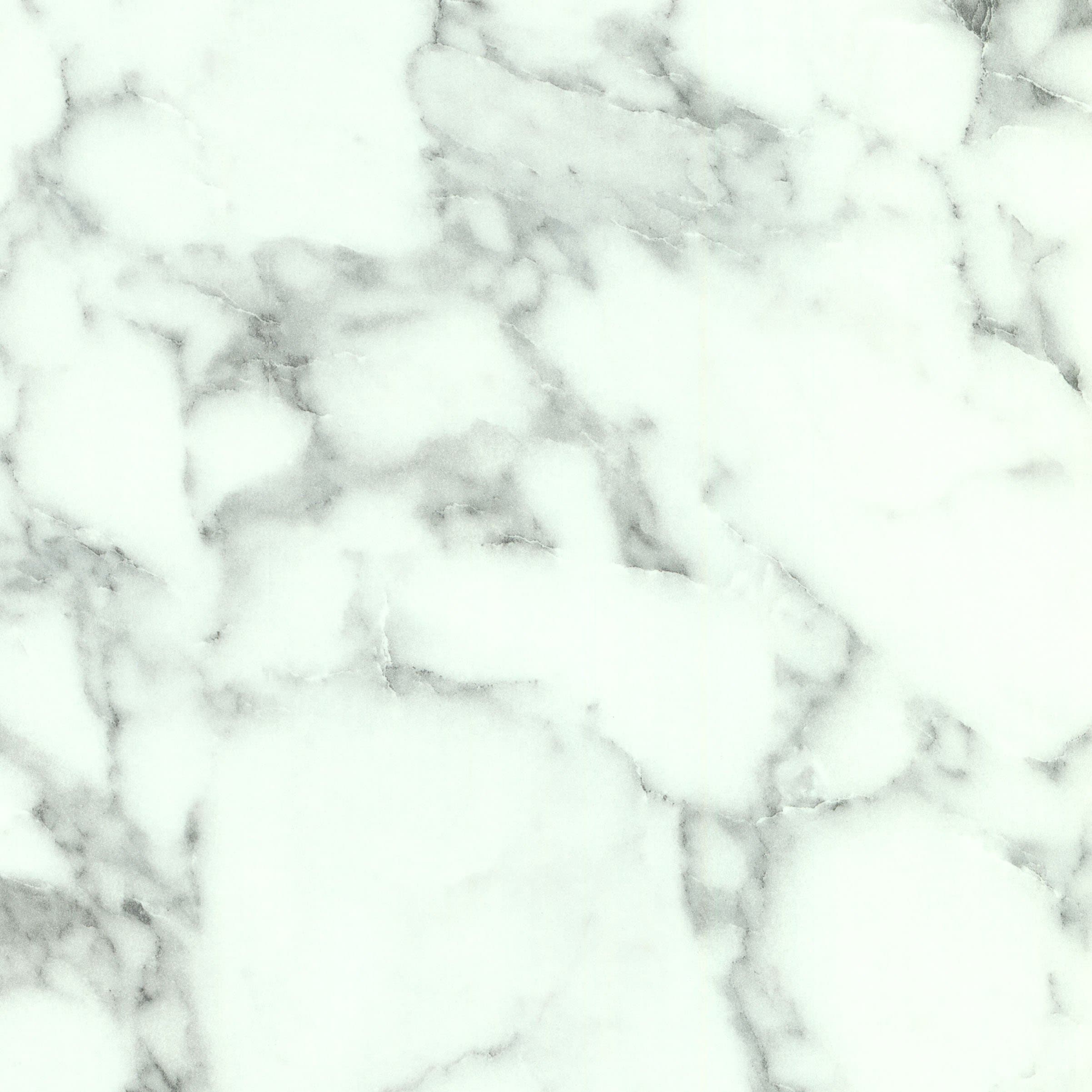 A stone-inspired laminate pattern in natural neutral and weathered mid-tone hues, defined by mineral-like movement, mottling, and natural tonal shifts