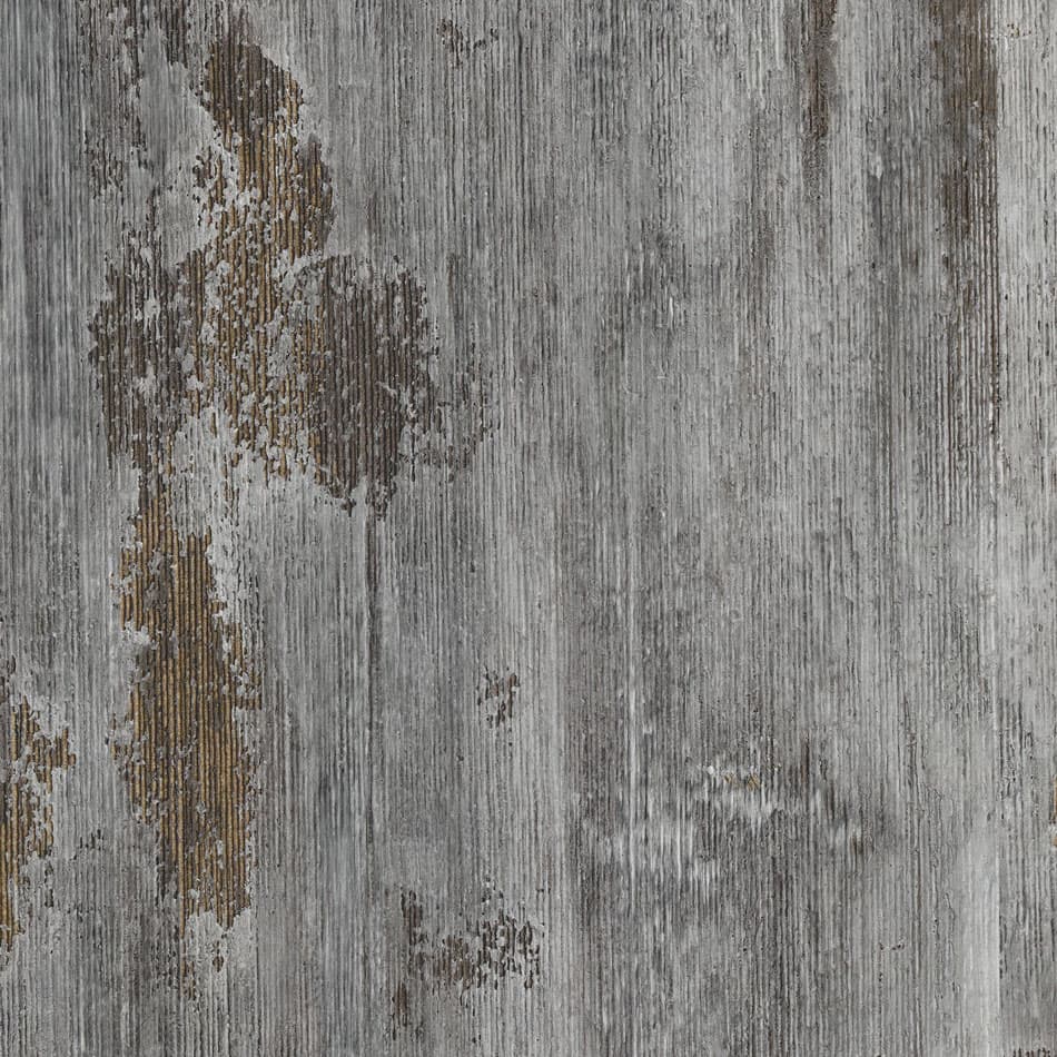 An abstract laminate pattern in gray tones, defined by layered marks, tonal variation, and restrained visual movement