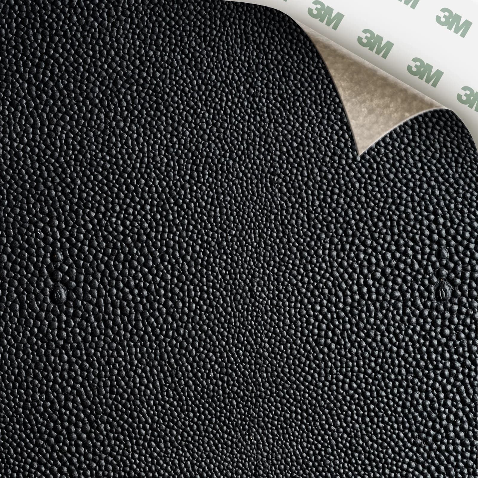 EcoDomo Stratto Black Shagreen swatch with the peel-and-stick backing showing.