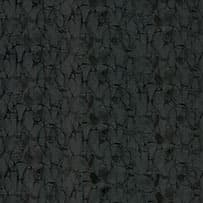 An abstract laminate pattern in black tones, defined by layered marks, tonal variation, and restrained visual movement