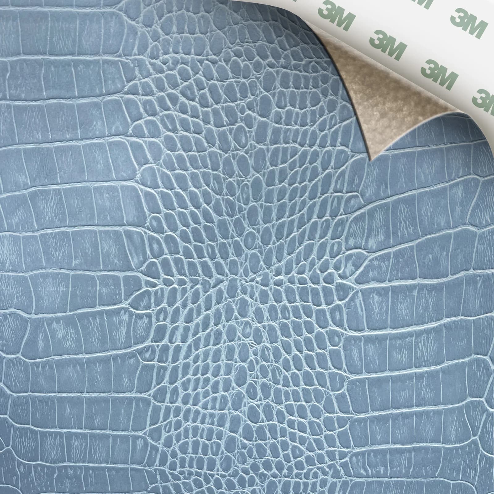 EcoDomo Stratto Arctic Blue Crocodile swatch with the peel-and-stick backing showing.
