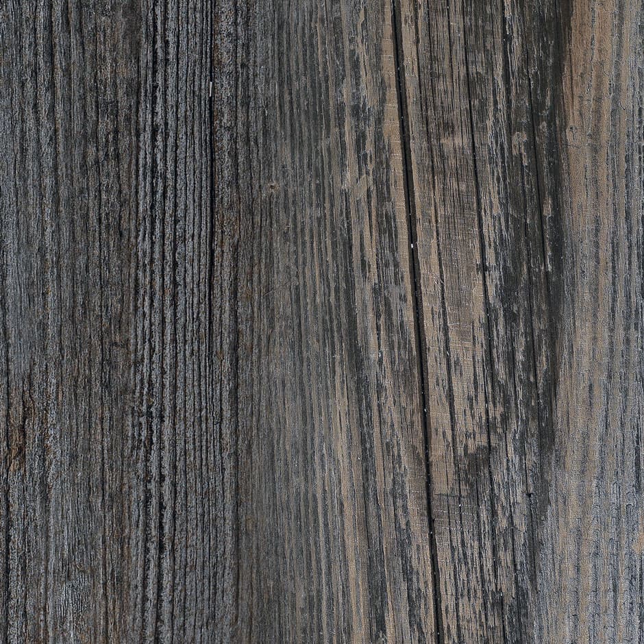 A woodgrain laminate pattern in balanced neutral and mid-tone hues, defined by natural grain movement and layered tonal variation